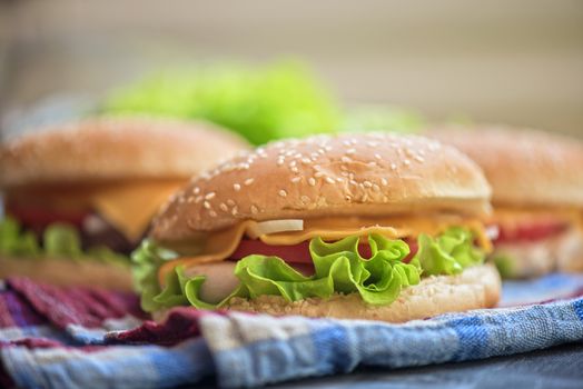 Closeup of home made burgers on wooden table