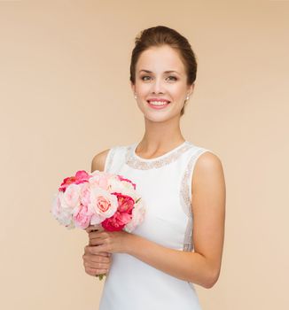 happiness, wedding, holidays and celebration concept - smiling bride or bridesmaid in white dress with bouquet of flowers