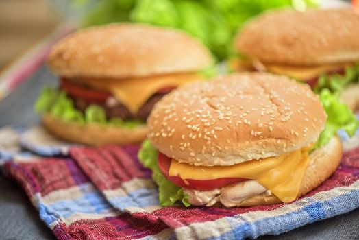 Closeup of home made burgers on wooden table