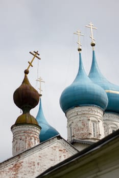 falling cross old Orthodox Church against the new domes background religion Christianity