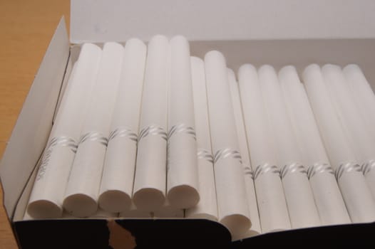 Pre-made cigarettes cores for home charging.