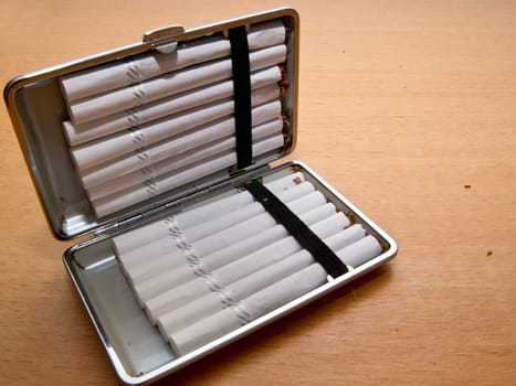 The filled cigarette in the tray is loaded.