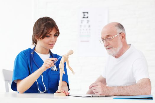 nurse and doctor looking at human figure