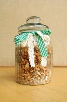 Glass jar with band full of cracked walnuts
