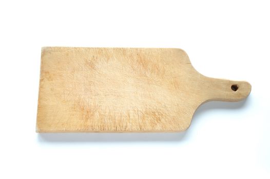 Old wooden chopping board on white background