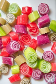 Colorful candies on white background