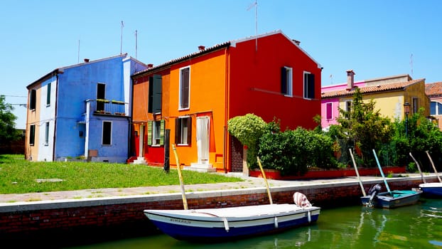 Burano colorful building architecture with boat and water, Venice, Italy