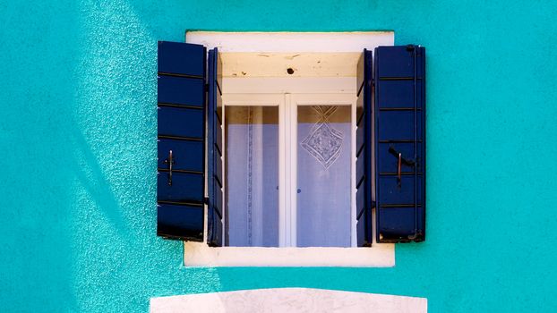 blue Window in Burano on blue ccolor wall building architecture, Venice, Italy