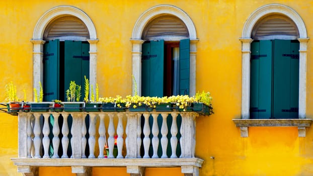 two Doors and terrace in Burano on yellow color wall building architecture,Venice, Italy