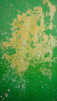 decay green color wall in Burano, Venice, Italy
