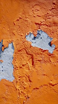 decay orange color wall in Burano, Venice, Italy