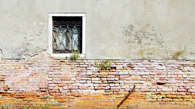 window and ancient decay wall half brick wall building architecture in Murano, Venice, Italy