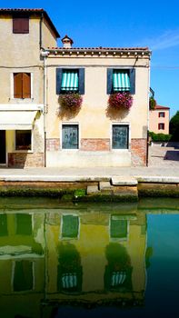 building architecture in Murano with reflection, Venice, Italy
