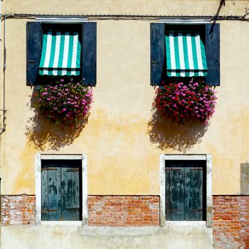 two doors and two windows house building in Murano, Venice, Italy