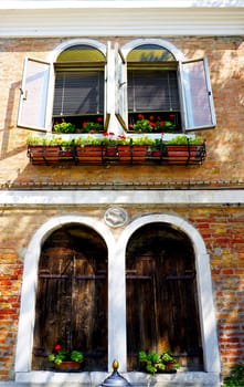 two doors and two windows house building architecture in Murano, Venice, Italy