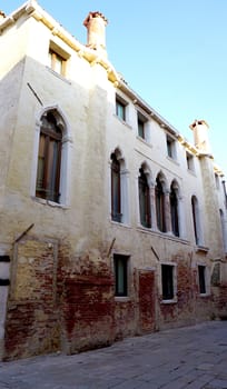 Alley with ancient architecture in Venice, Italy