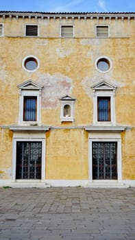 ancient building with windows and doors in Venice, Italy