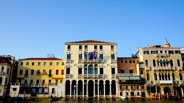 ancient buildings piers and gondola in Venice, Italy