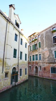 old buildings and canal in Venice, Italy