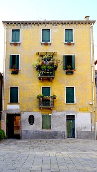 old yellow color building front elevation in Venice, Italy