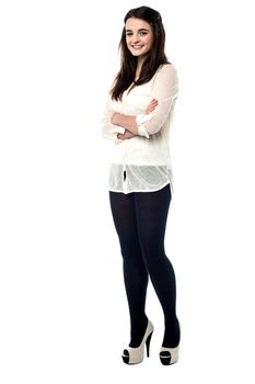 Full length of stylish teen girl with folded arms