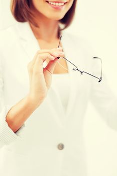 business and education concept - indoor picture of woman with eyeglasses