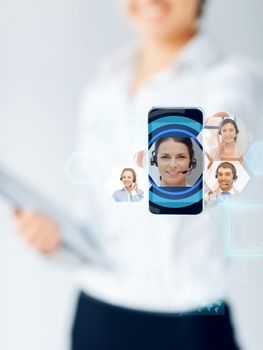 business, education, people and technology concept - close up of businesswoman showing smartphone screen with video chat icons