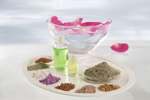 Body care and spa treatment concept, range of coloured french clay and essential oil for mud therapy