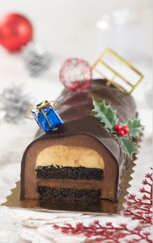 Christmas chocolate yule log cake with decoration