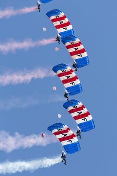 The Royal Air Force Falcons Parachute Display Team in action