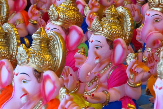 Newly made idols of the Elephant God known as Ganesha or Ganapati for sale at a shop on the eve of Ganesh festival in India.                               