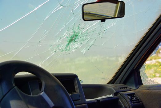 Damaged car window after a crash