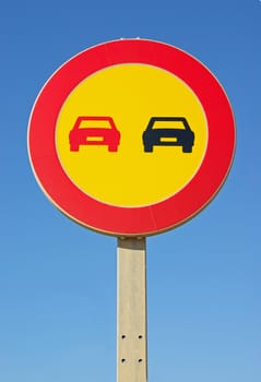 Yellow background No overtaking signal in a road