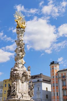 Image of the Holy Trinity Column and the town hall in the background in Linz, Austria