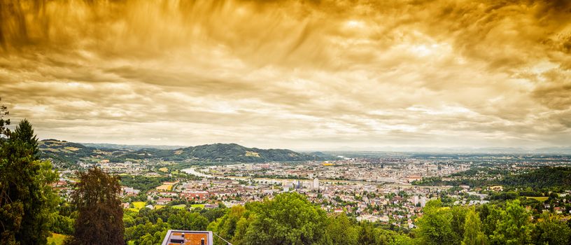 Panorama image of Linz in Austria with dramatic clouds