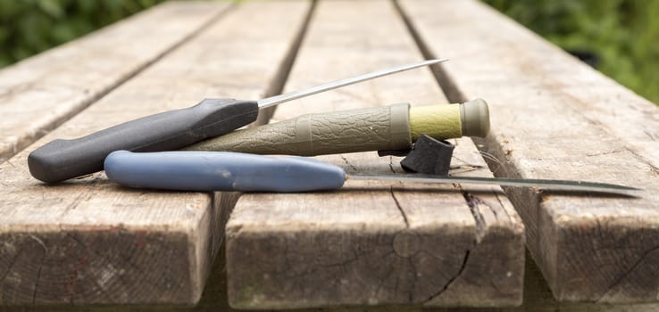 Thrre Knifes Lying on Table