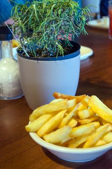 Dutch potato fries on wood table