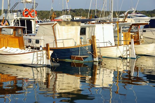 Mediterranean boats on the pier of Porto Colom in Majorca (Spain)