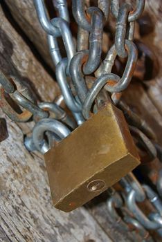 Strong padlock used to close a door with a chain