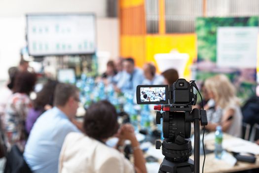 Covering a business meeting with a video camera