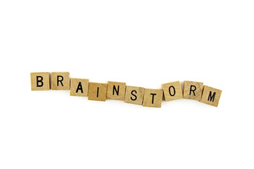 Brainstorm word wooden alphabet blocks on white background from top view