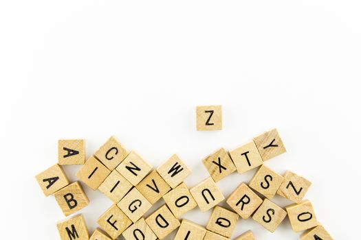 Wooden alphabet blocks use as background isolated