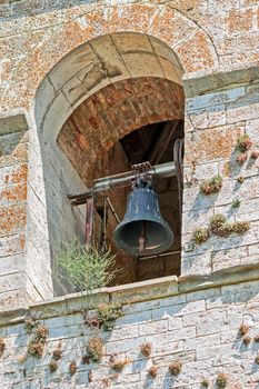 antique bell tower with vegetation