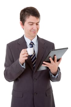 Portrait of a businessman looking at tablet pc and holding cup of coffee, isolated
