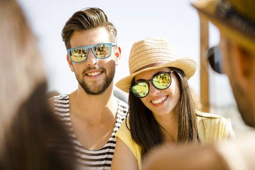 Fiends having a great time together at the beach bar