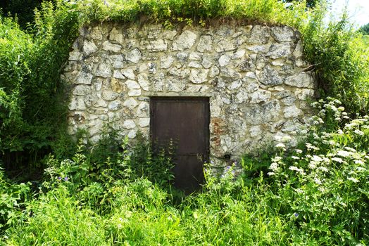 Metal door to vintage cellar