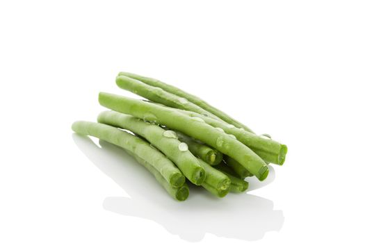 Fresh green beans with water drops isolated on white background. Healthy eating. 