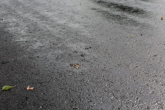 Freshly laid black tar asphalt pavement - a new road surface made of bitumen.