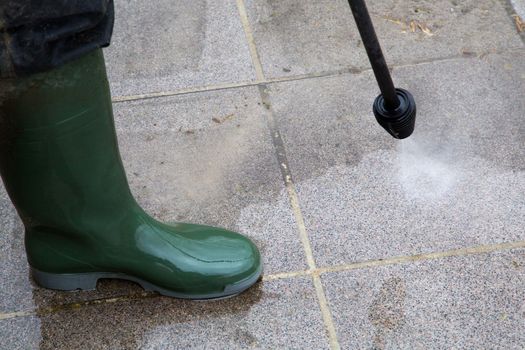 Outdoor floor cleaning with high pressure water jet