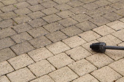 Outdoor floor cleaning with high pressure water jet